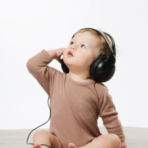 Baby listening to relaxing music from headphones 