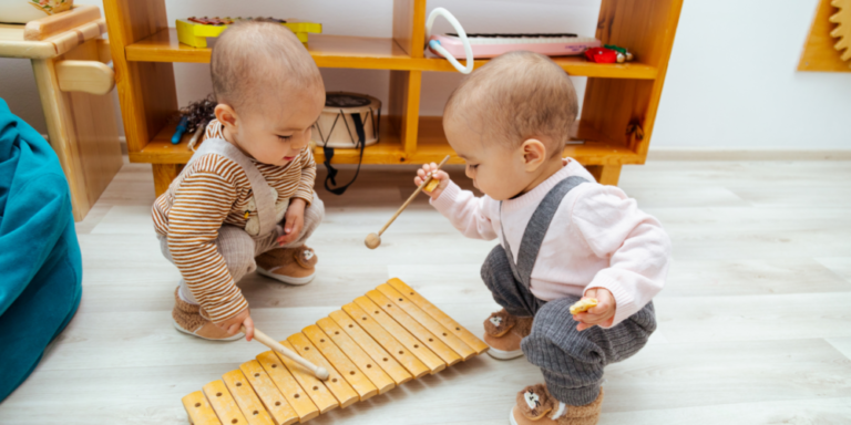Early Learning Through Music with two babies playing with music instrument